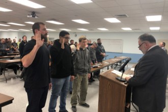 group of people completing oath